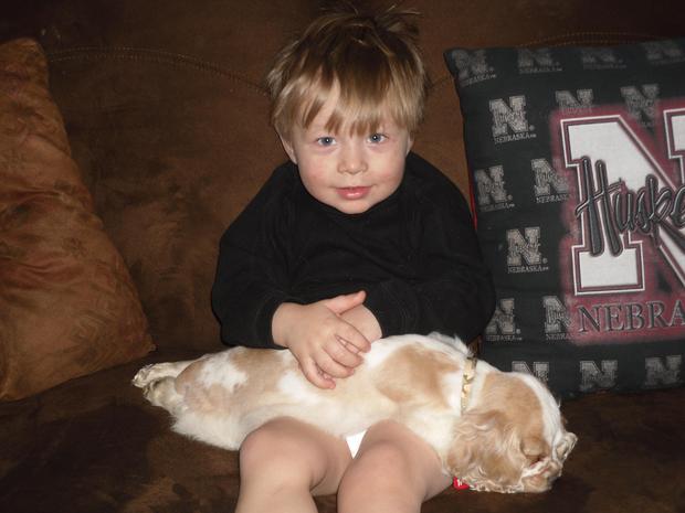 My nephew Jj holding a very worn out Charlie.